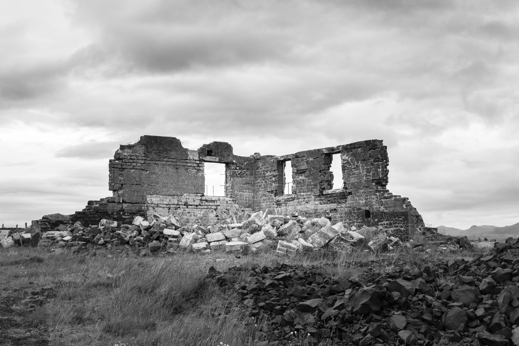 The remains of a hospital wall. Black and white.