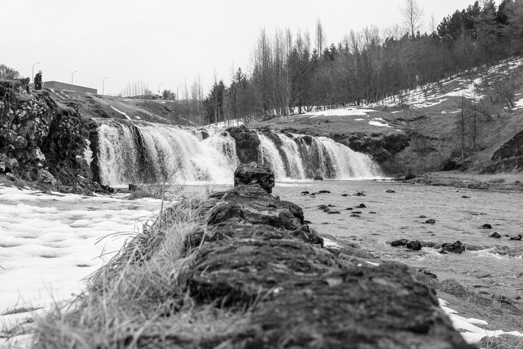 Another view of the waterfall in Varmá. The wall is straight down the centre of the image