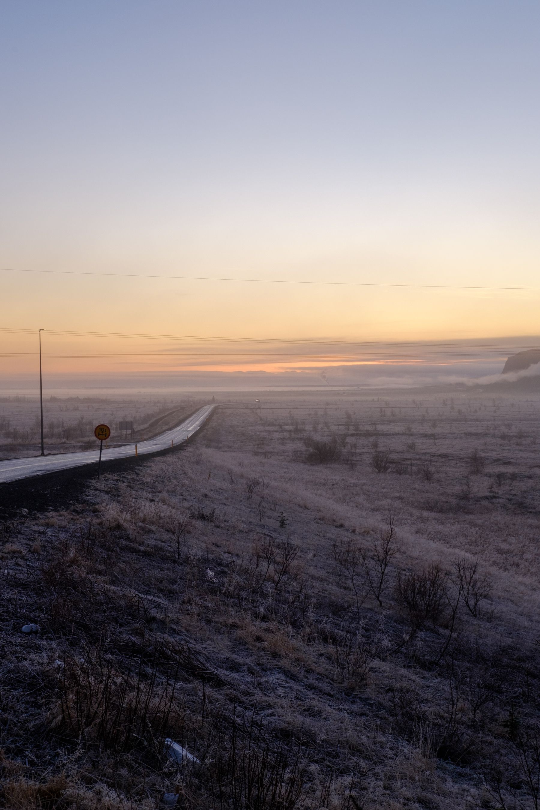 A view of the road from Hveragerði to Þorlákshöfn. Frost covers the ground