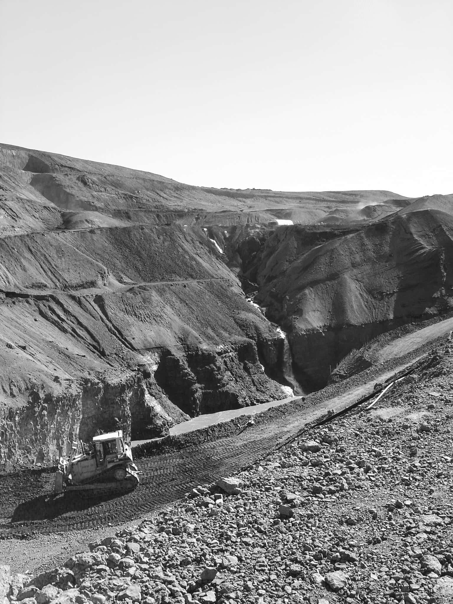 A black and white photo I took of the construction site of a blasted landscape that used to be untouched nature.