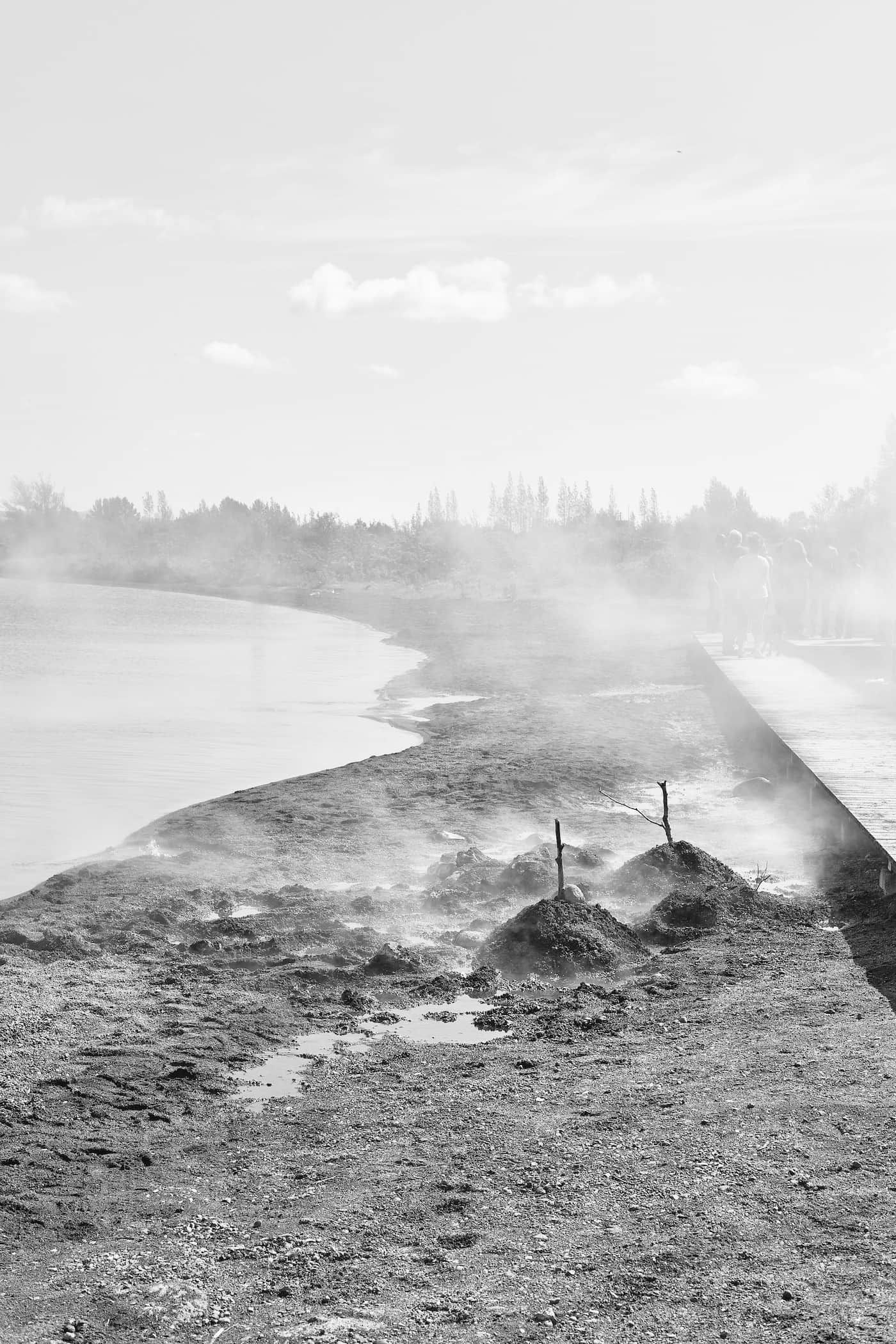 Steam from a local geothermal spring wafts over the shore of Laugarvatn